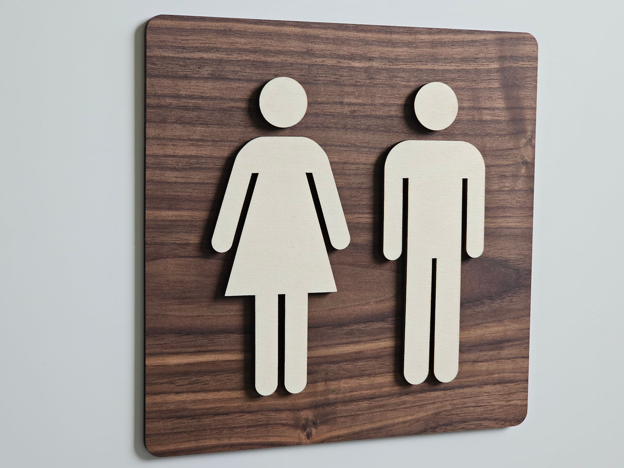 Elegant toalettskylt med manliga och kvinnliga piktogram i valnöt och poppelträ